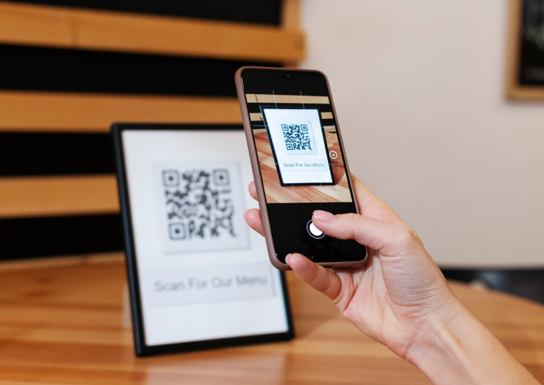 Customer scanning a QR code to open a feedback survey